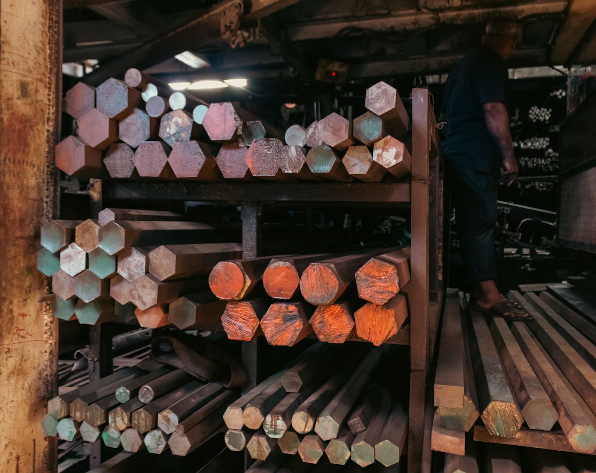 Alloy steel bars racked by grade, ends colour coded